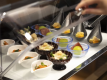 The premium lounge offers not only snacks but also light meals. Deliciousness overflows from the small plates.