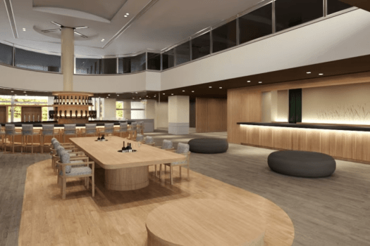 【ロビーラウンジ】ロビーラウンジを2025年7月に一部リニューアル。一枚板のテーブルと奥に円形のドリンクカウンターを設えました。