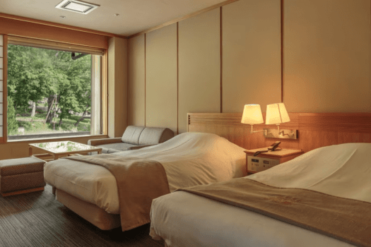 [Luxury twin room with spa living room, 60 square meters (mountain side)] The bedroom is next to the living room, making for a spacious room.