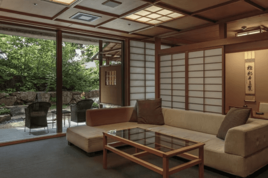 [Special room with garden open-air bath, 80 square meters / "Mizu Asagi"] There is a sofa in the living room.