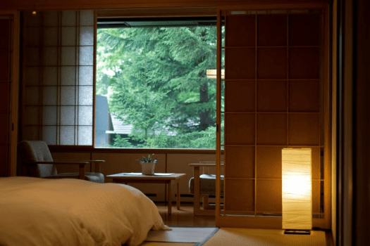 [90 square meters Japanese-Western style room with panoramic bath] Sit in a chair by the window while reading a book. We aimed to create a room that exudes the warmth of Japanese culture, and that will accompany travelers throughout their day.