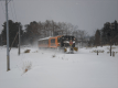 地吹雪の中を走るストーブ列車