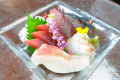 "Sashimi" is a dish in which seafood and other seafood are eaten raw. It is eaten with condiments such as wasabi and ginger, and with soy sauce.