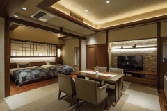 【露天風呂付・川側】深川 スイート：室内には、ご家族やお仲間とご歓談いただけるダイニングテーブルや、寝心地を追及したシモンズ製のベッドを備えました。