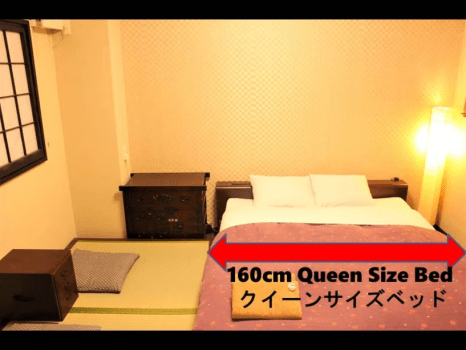 The bed is a queen-size bed, 160 cm wide.